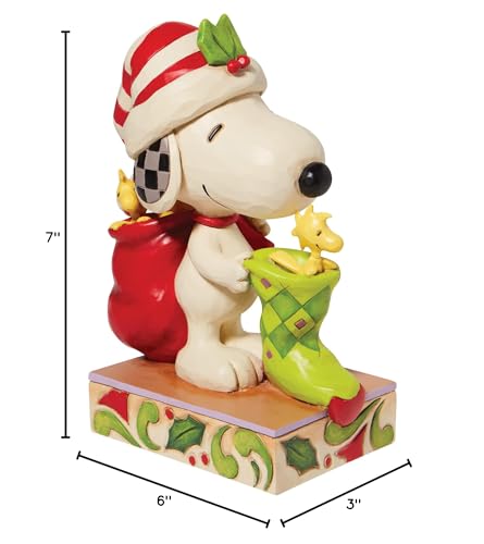 Enesco Peanuts by Jim Shore Snoopy with Woodstocks and a Stocking Figurine, 7 Inch, Multicolor