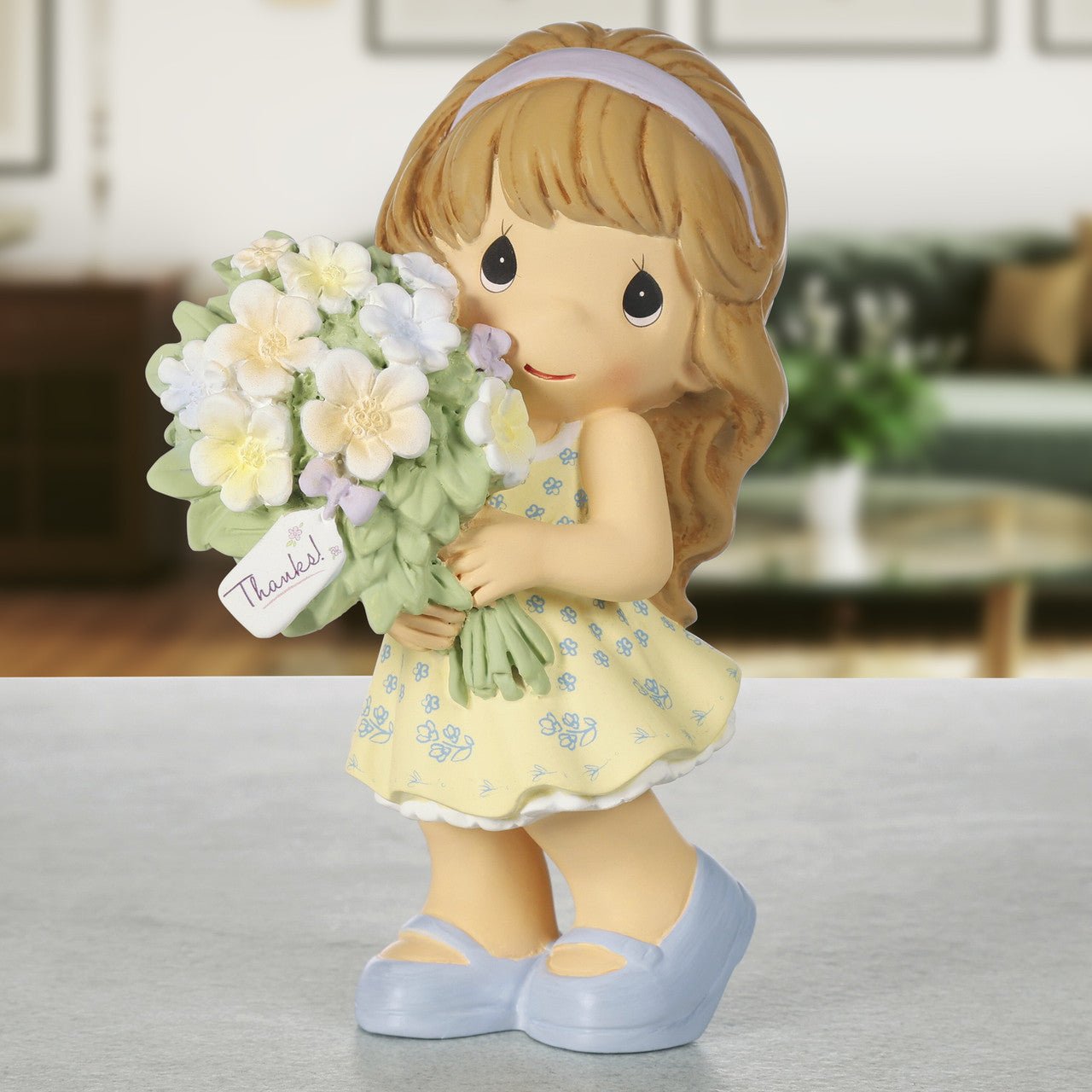 Girl Holding Bouquet of Flowers Figurine